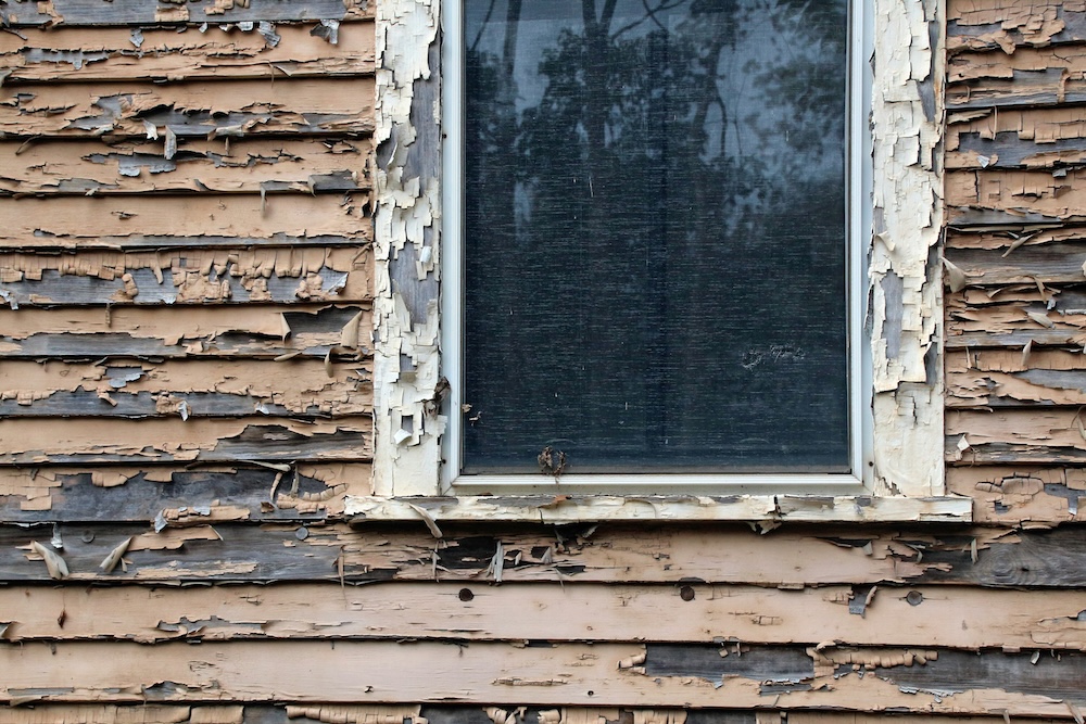 Exterior wall detail showing siding texture and weathering